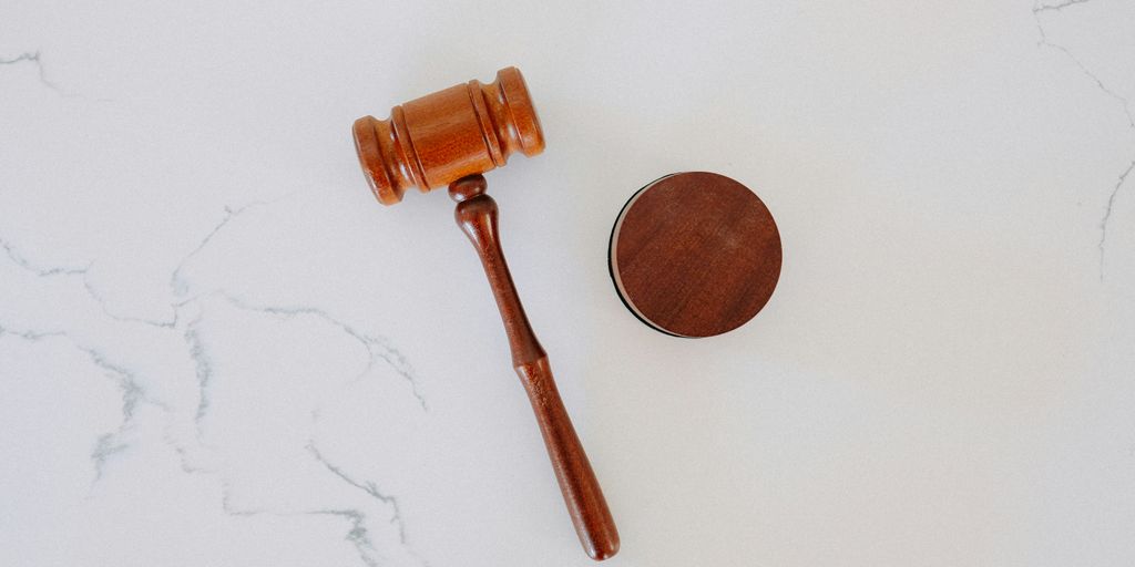 brown wooden smoking pipe on white surface